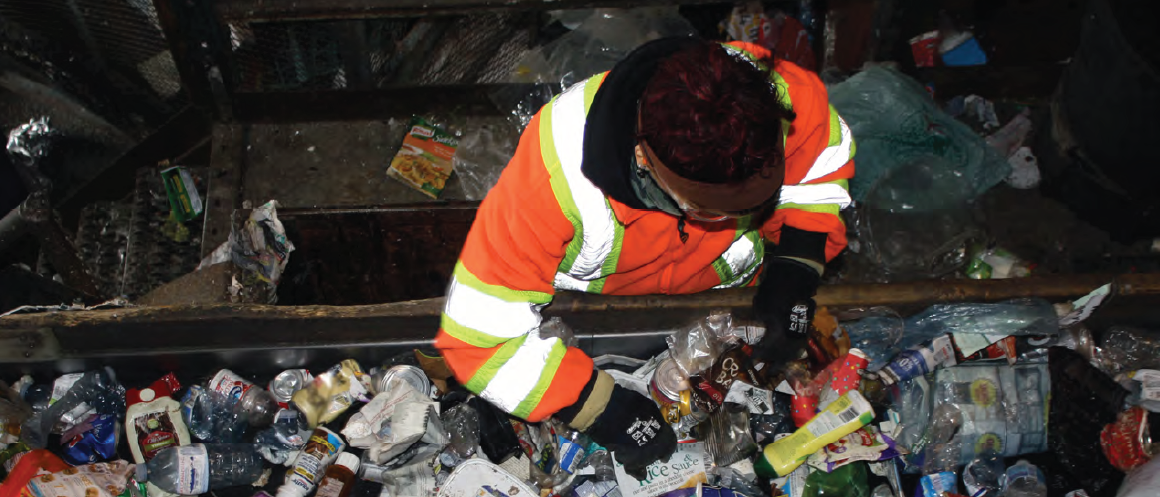 staff member sorting recycling