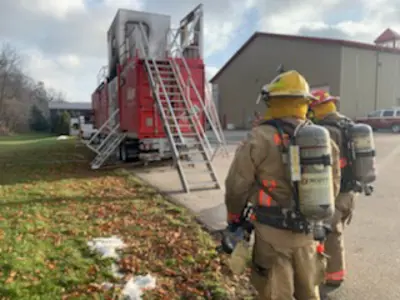 Firefighter using  Mobile Live Fire Training Unit 