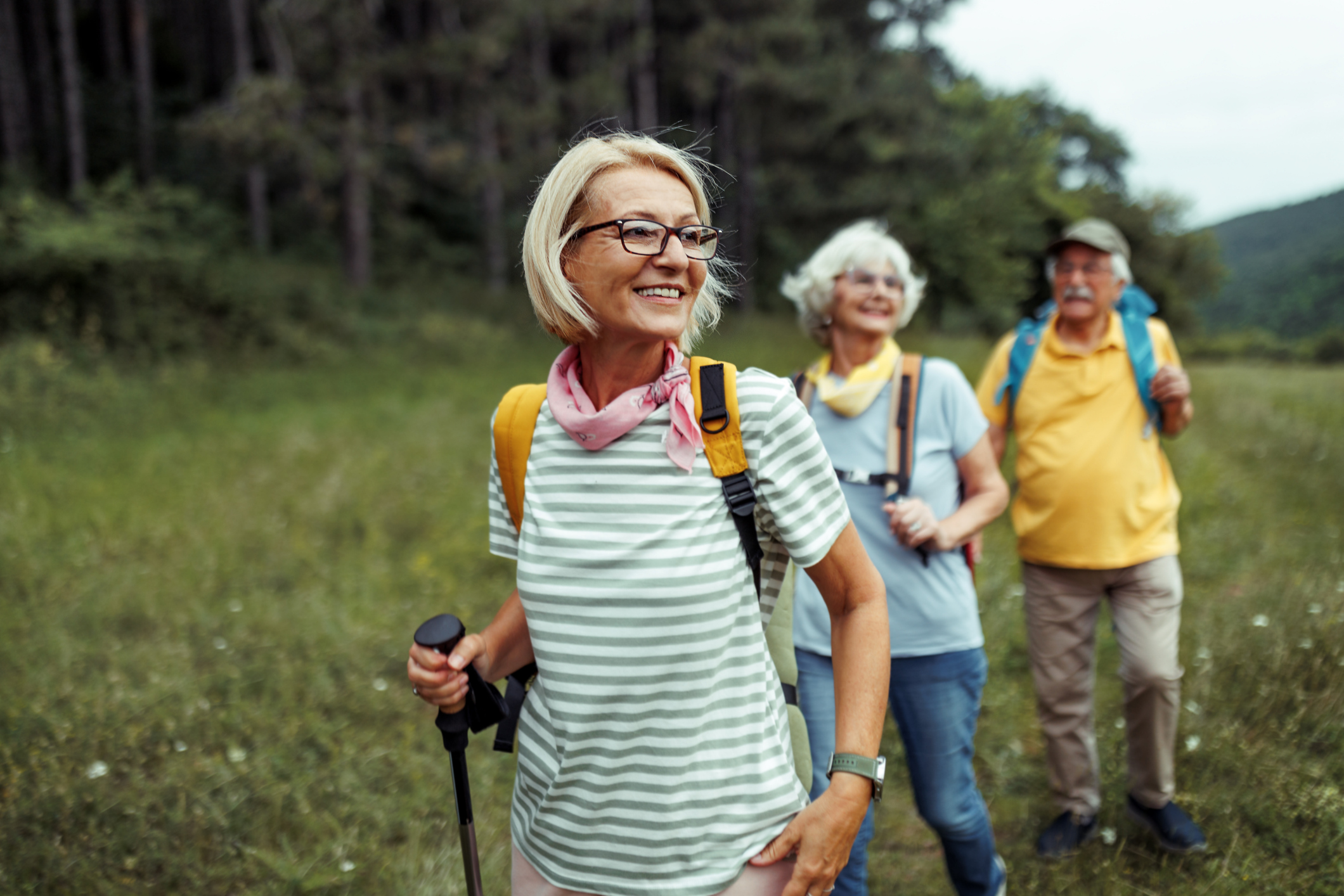 Mature woman enjoying her day in forest with friends 