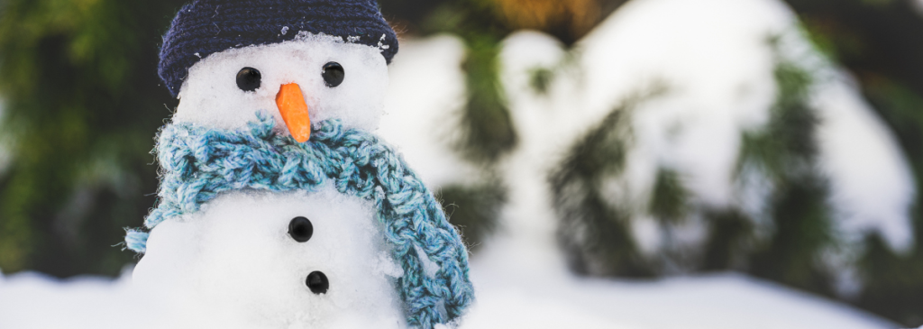 Snowman wearing a blue scarf
